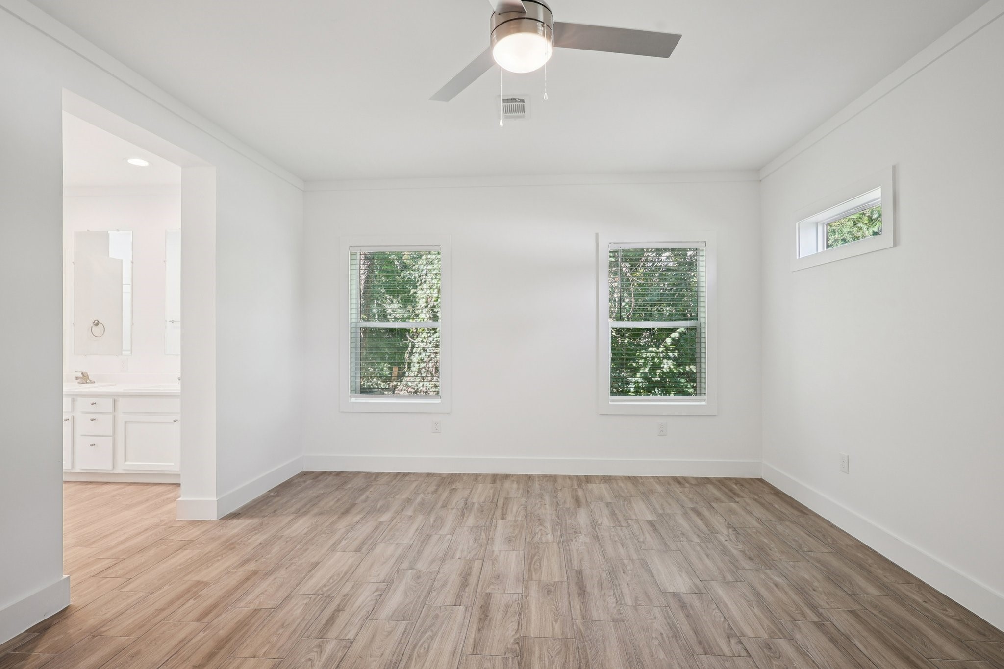 3917 Sayers Street Houston, TX 77026 - Photo 22 of 26 wooden floor in an empty room with a window