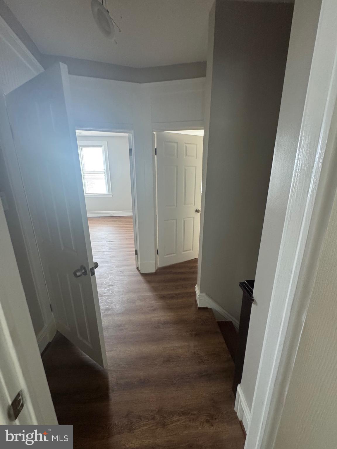 2613 Maisel Street Baltimore, MD 21230 - Photo 13 of 15 a view of a hallway with wooden floor and staircase