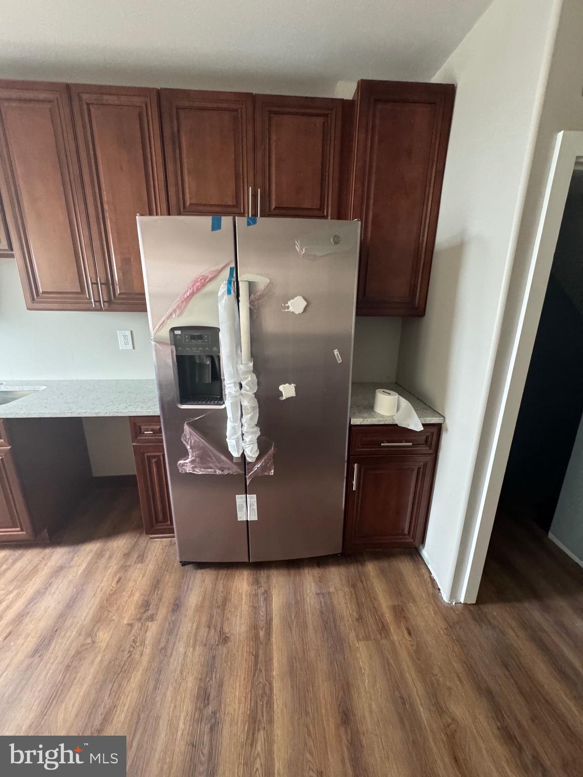 2613 Maisel Street Baltimore, MD 21230 - Photo 7 of 15 a room with wooden floor and washing machine
