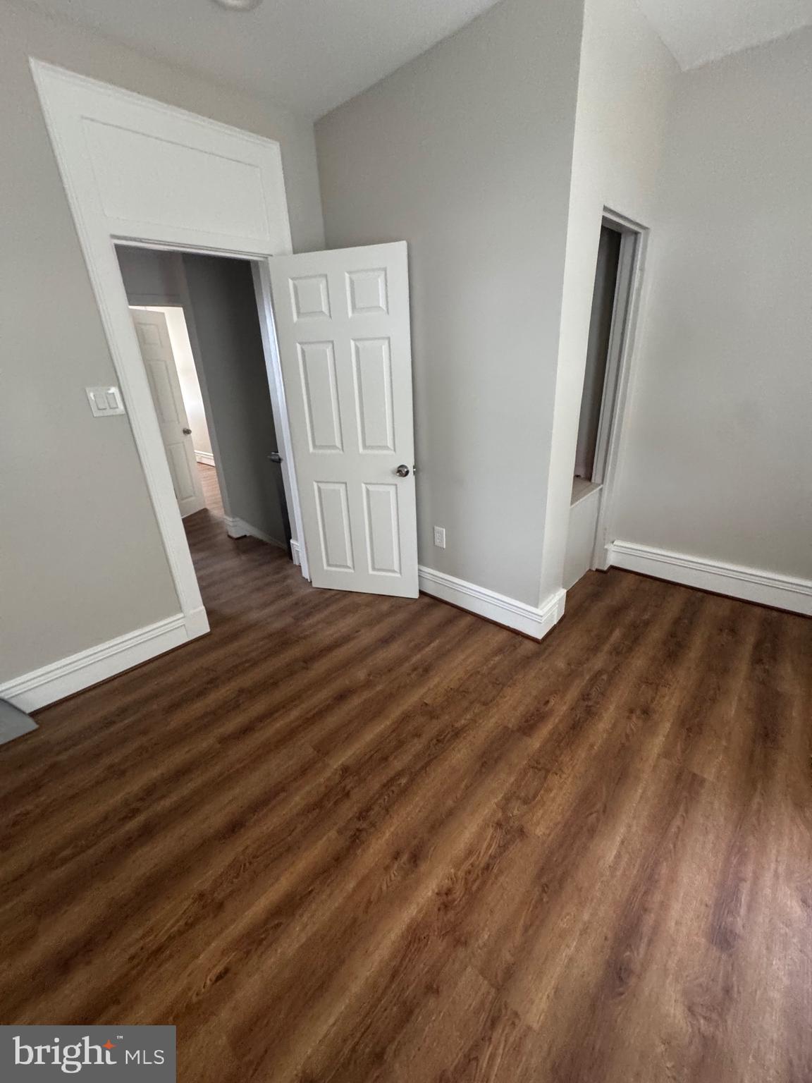 2613 Maisel Street Baltimore, MD 21230 - Photo 9 of 15 an empty room with wooden floor and closet