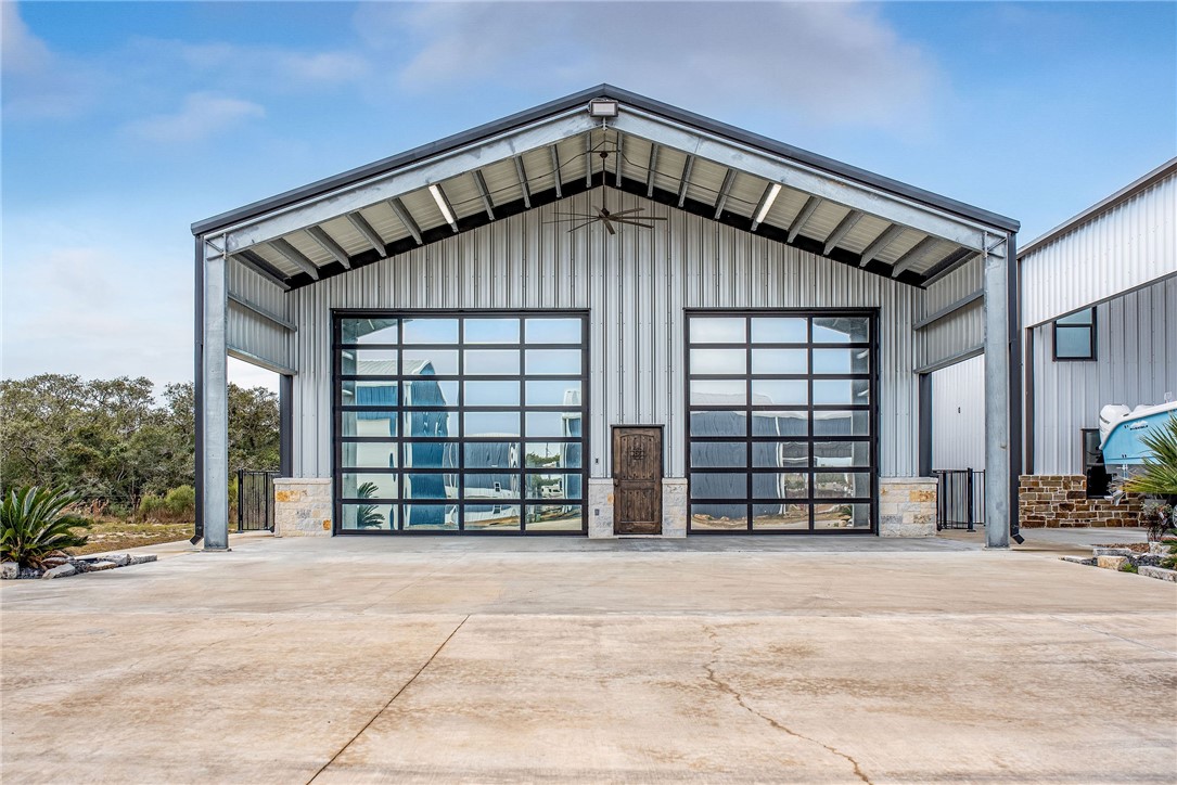82 Cir Hook Port O'Connor, TX 77982 - Photo 3 of 32 Large Sleek Glass/Mirrored Roll Up Doors 16 x 14'