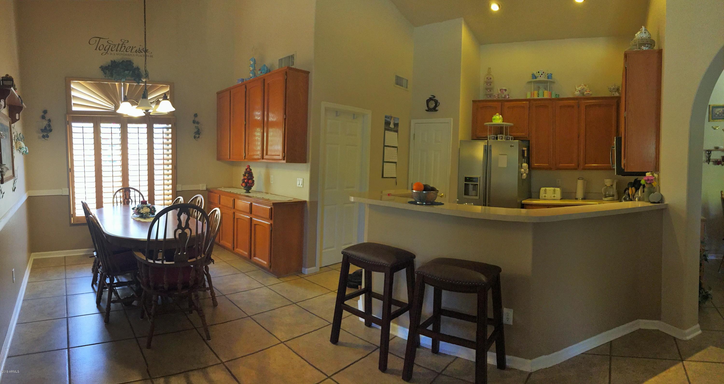 13186 West Granada Road Goodyear, AZ 85395 - Photo 27 of 72 Kitchen and Dining Room