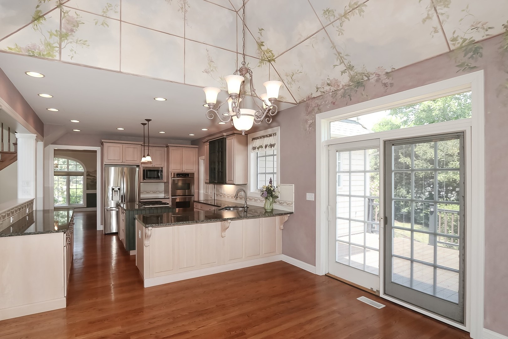 S331 South Mathewson Lane Geneva, IL 60134 - Photo 13 of 40 a view of a big room with wooden floor and a kitchen