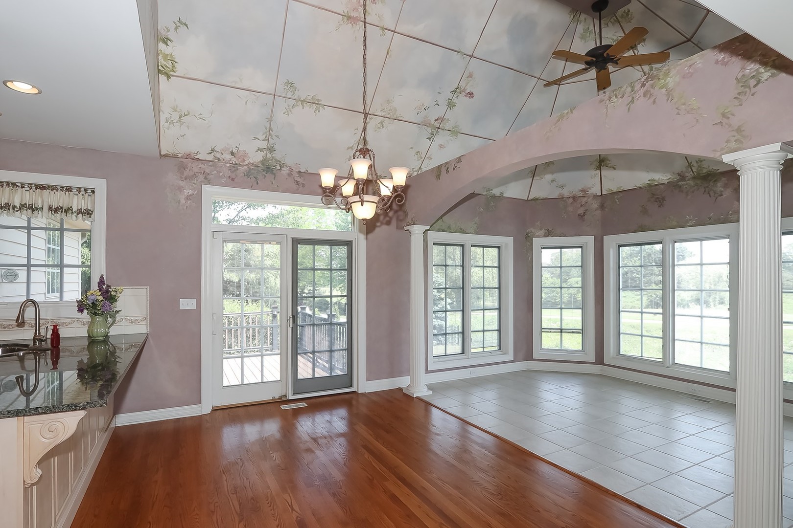S331 South Mathewson Lane Geneva, IL 60134 - Photo 14 of 40 a view of a livingroom with furniture window wooden floor and a ceiling fan