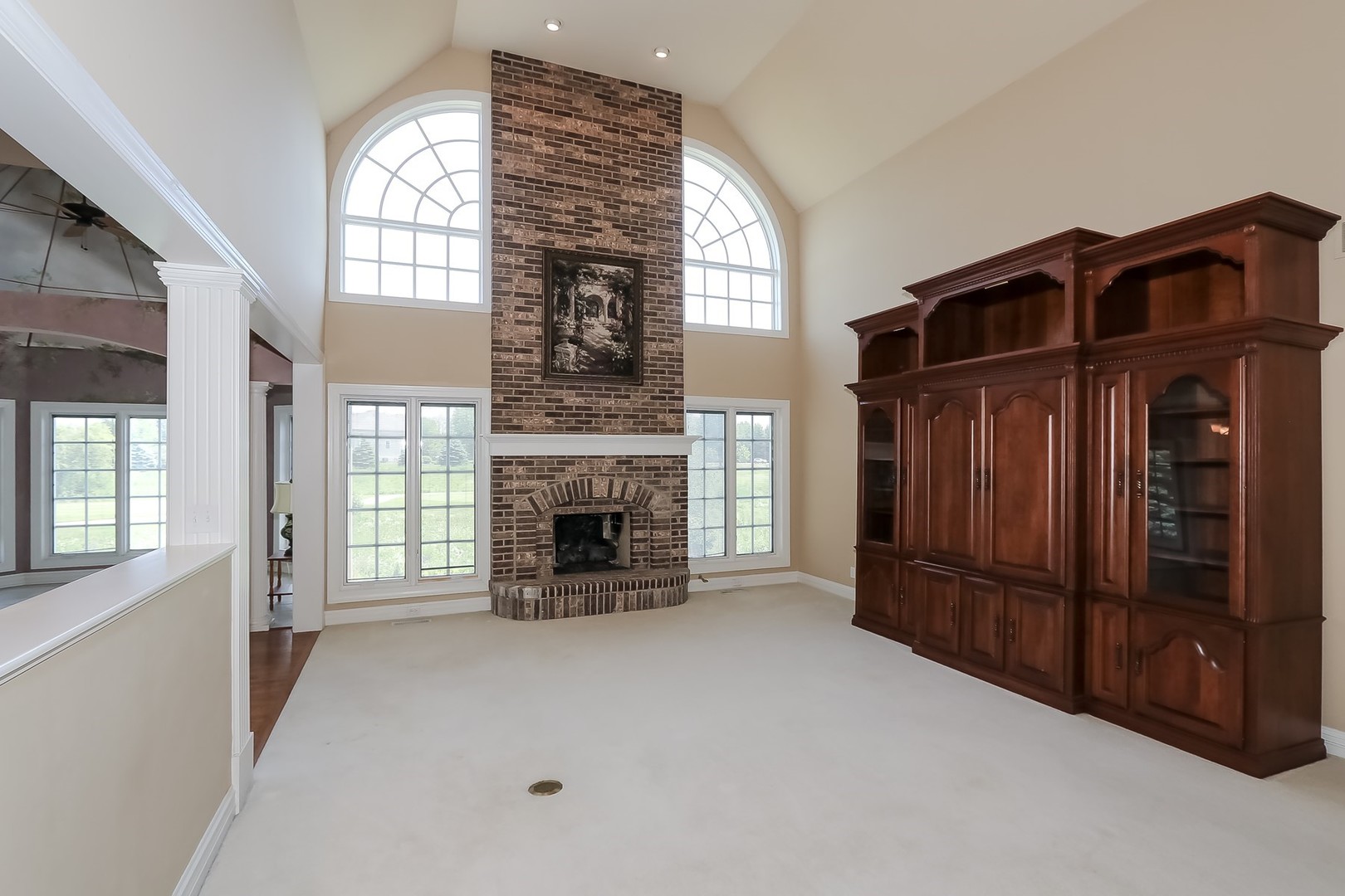 S331 South Mathewson Lane Geneva, IL 60134 - Photo 5 of 40 a view of an empty room with a fireplace and a window