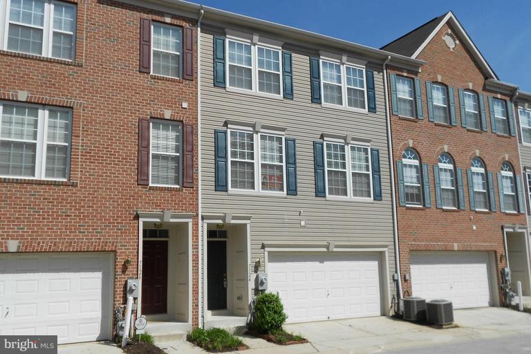 7124 Silverleaf Oak Road, Unit 226 Elkridge, MD 21075 - Photo 1 of 1 a front view of residential houses