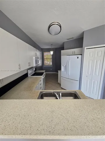 a room with gym equipment and a large window