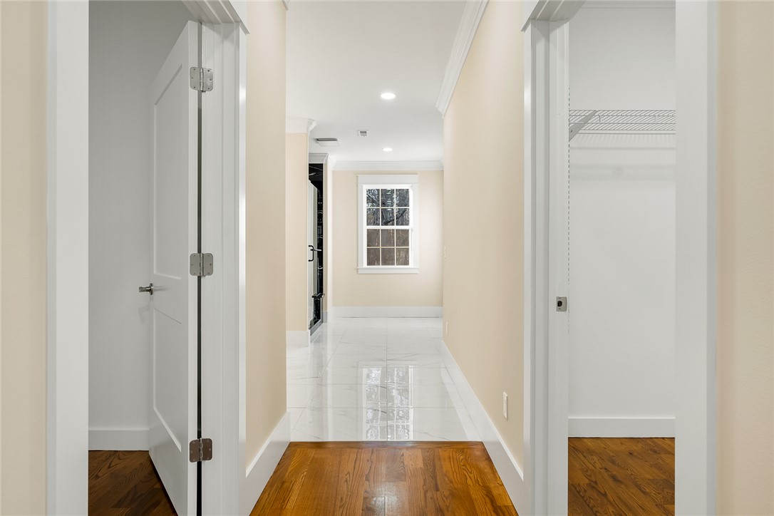 303 Regency Circle Anderson, SC 29625 - Photo 17 of 50 This bright hallway connects spaces with elegant flooring and natural light.