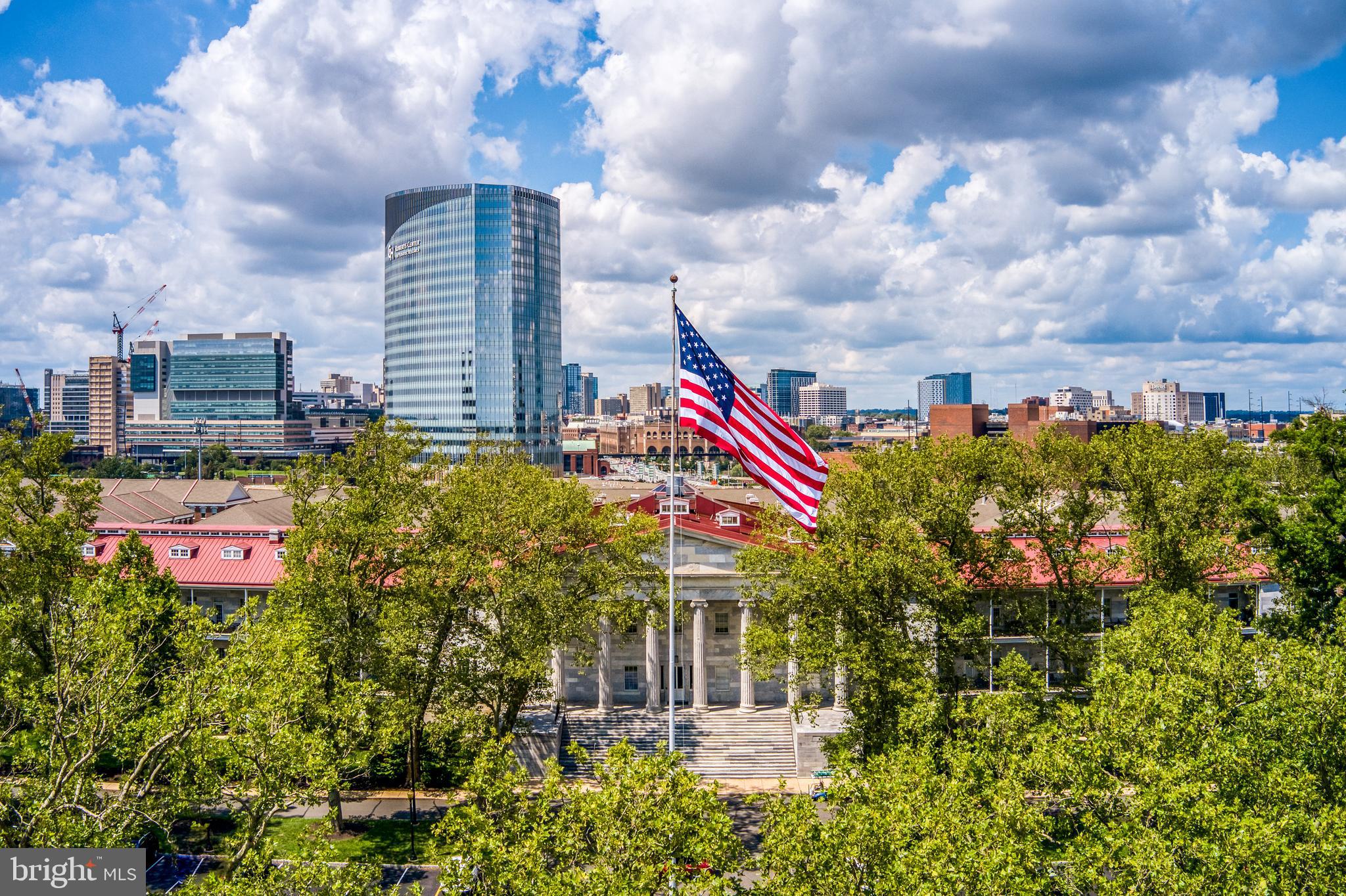 800 Admirals Way, Unit 1821 Philadelphia, PA 19146 - Photo 4 of 9 a multi story building with swimming pool and red chairs