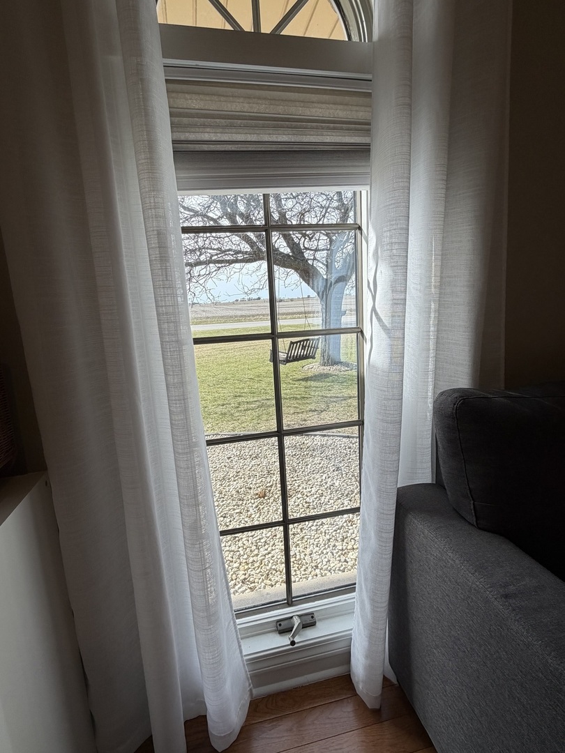 17245 County Line Road Plainfield, IL 60586 - Photo 17 of 45 a living room with furniture and a window