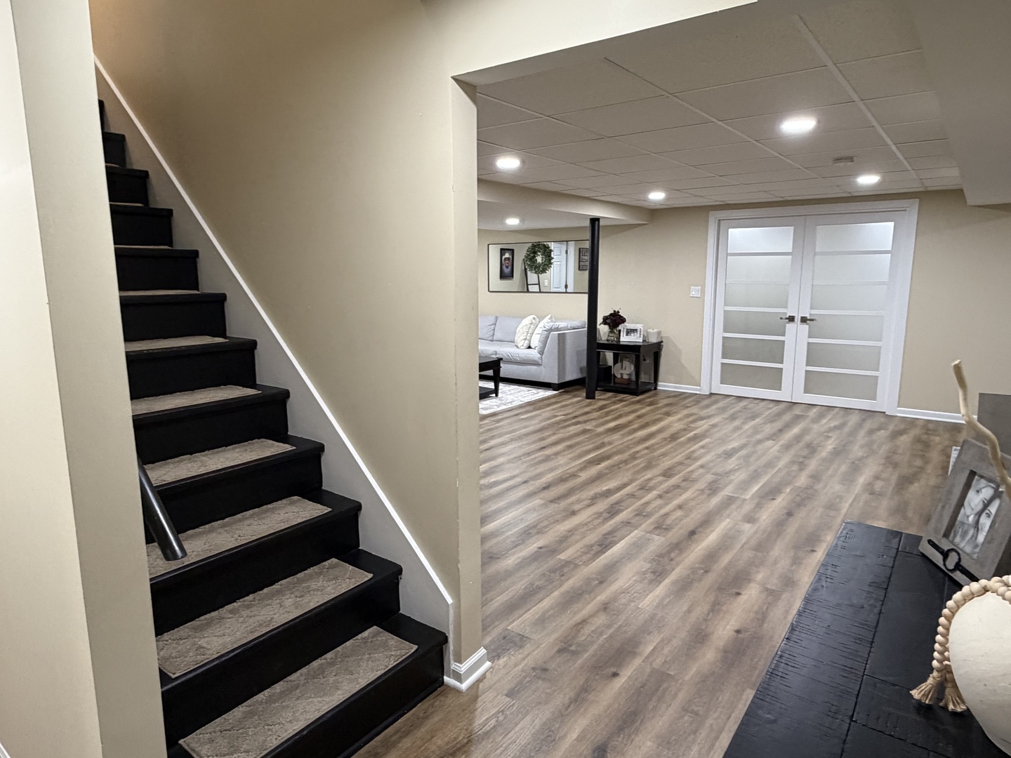 17245 County Line Road Plainfield, IL 60586 - Photo 25 of 45 a view of a livingroom with wooden floor and stairs