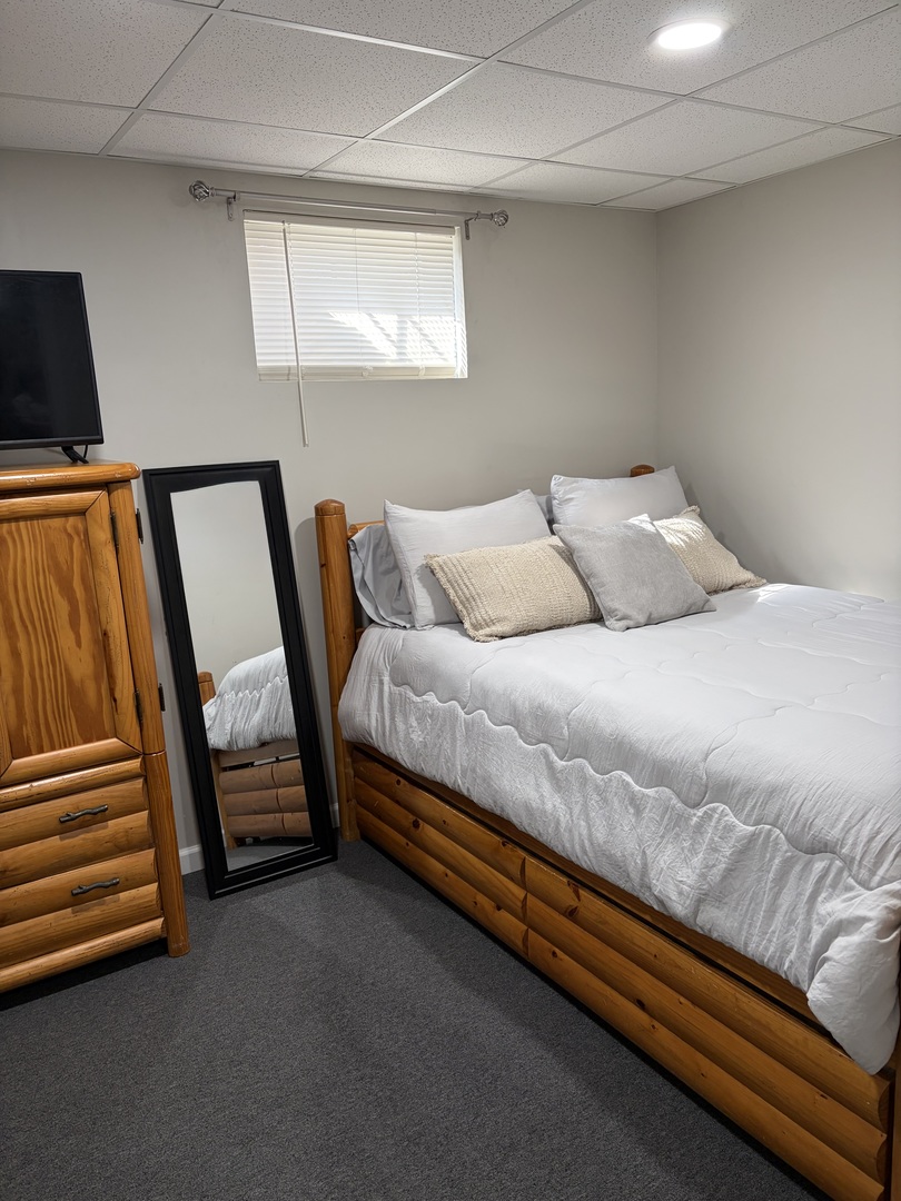 17245 County Line Road Plainfield, IL 60586 - Photo 33 of 45 a bed sitting in a bedroom next to a window