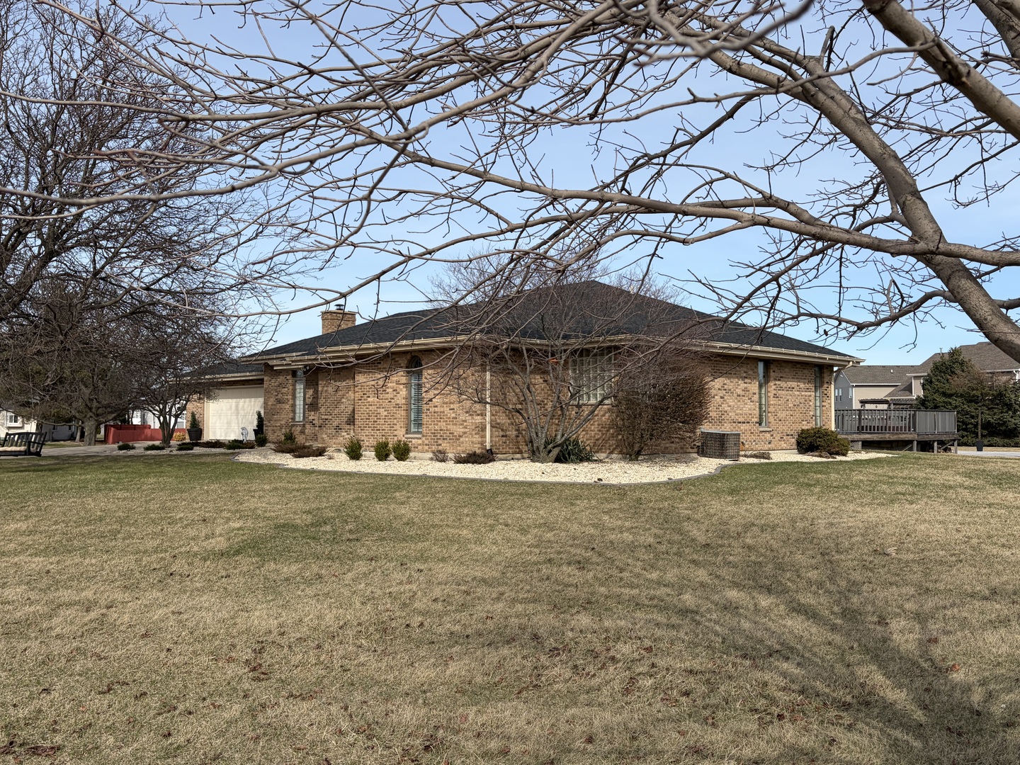 17245 County Line Road Plainfield, IL 60586 - Photo 45 of 45 a big house with a tree in the grass