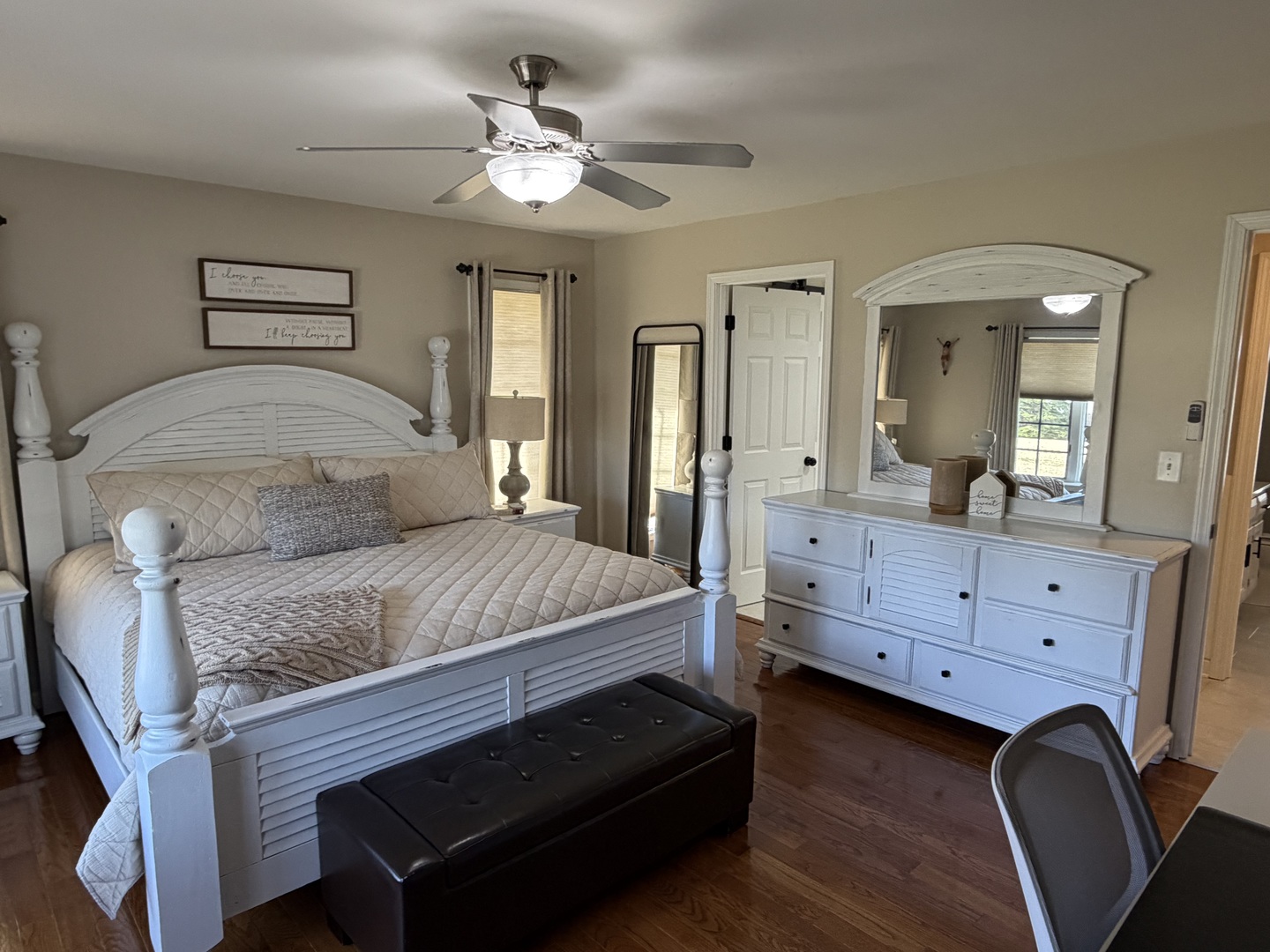 17245 County Line Road Plainfield, IL 60586 - Photo 10 of 45 a bedroom with a bed a chandelier and dresser