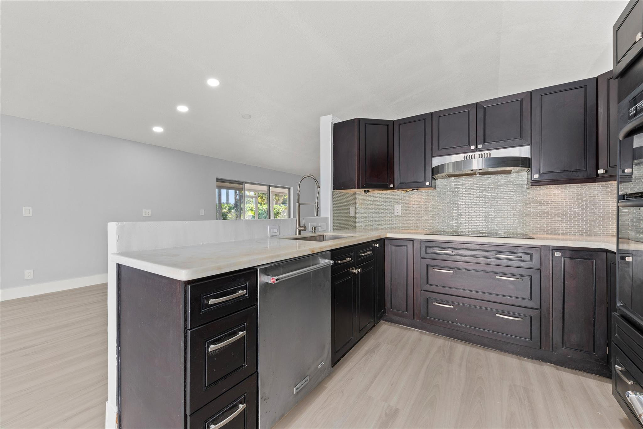 9918 Moss Pond Drive Boca Raton, FL 33496 - Photo 11 of 31 a kitchen with a sink and cabinets