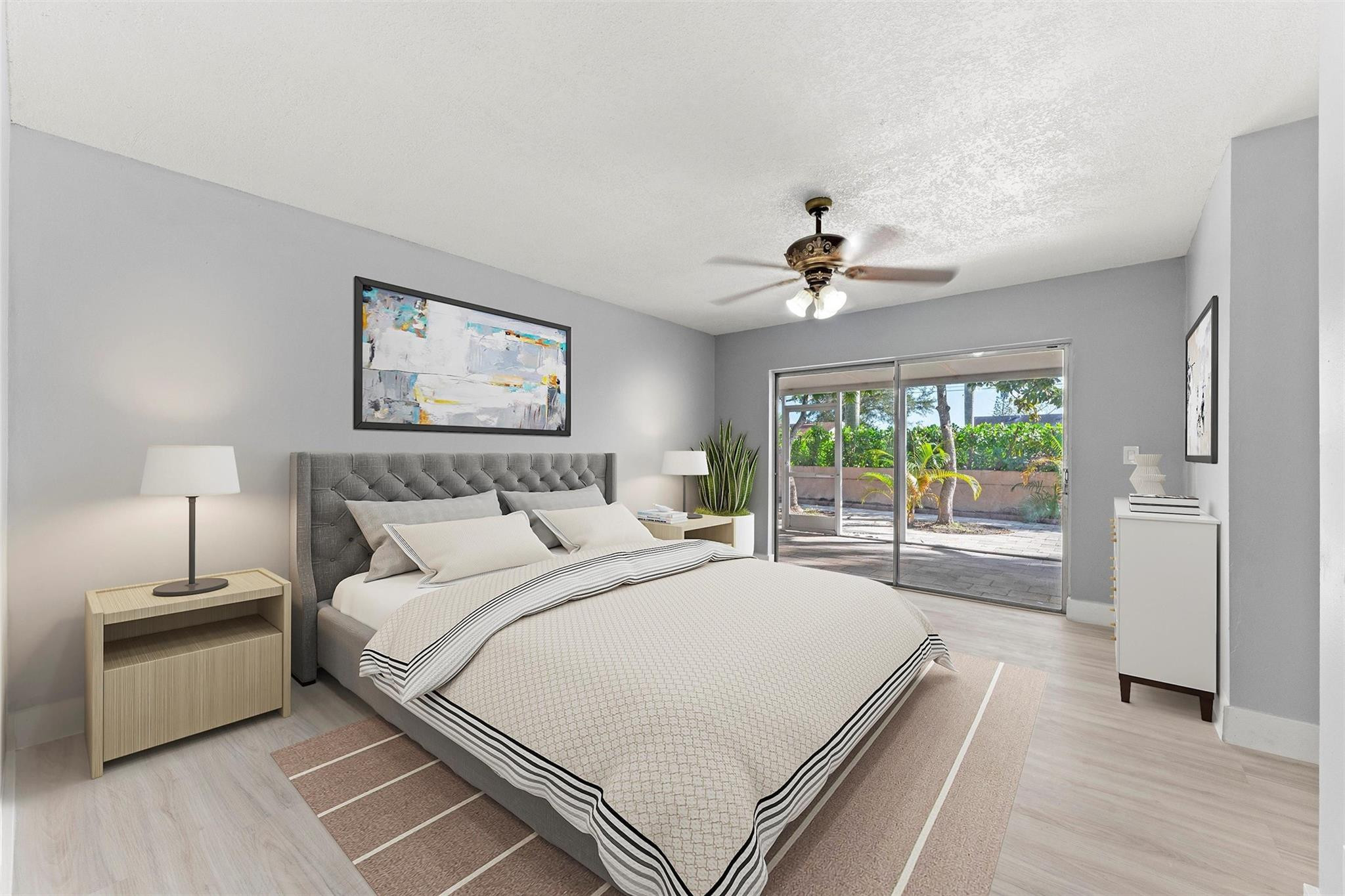 9918 Moss Pond Drive Boca Raton, FL 33496 - Photo 16 of 31 a spacious bedroom with a large bed and a chandelier