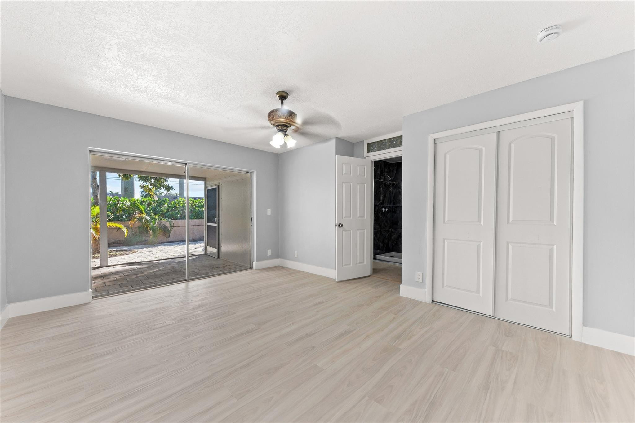 9918 Moss Pond Drive Boca Raton, FL 33496 - Photo 17 of 31 a view of empty room with wooden floor and fan