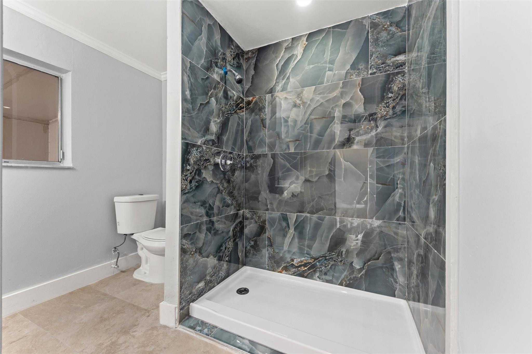 9918 Moss Pond Drive Boca Raton, FL 33496 - Photo 18 of 31 a bathroom with a shower and a toilet