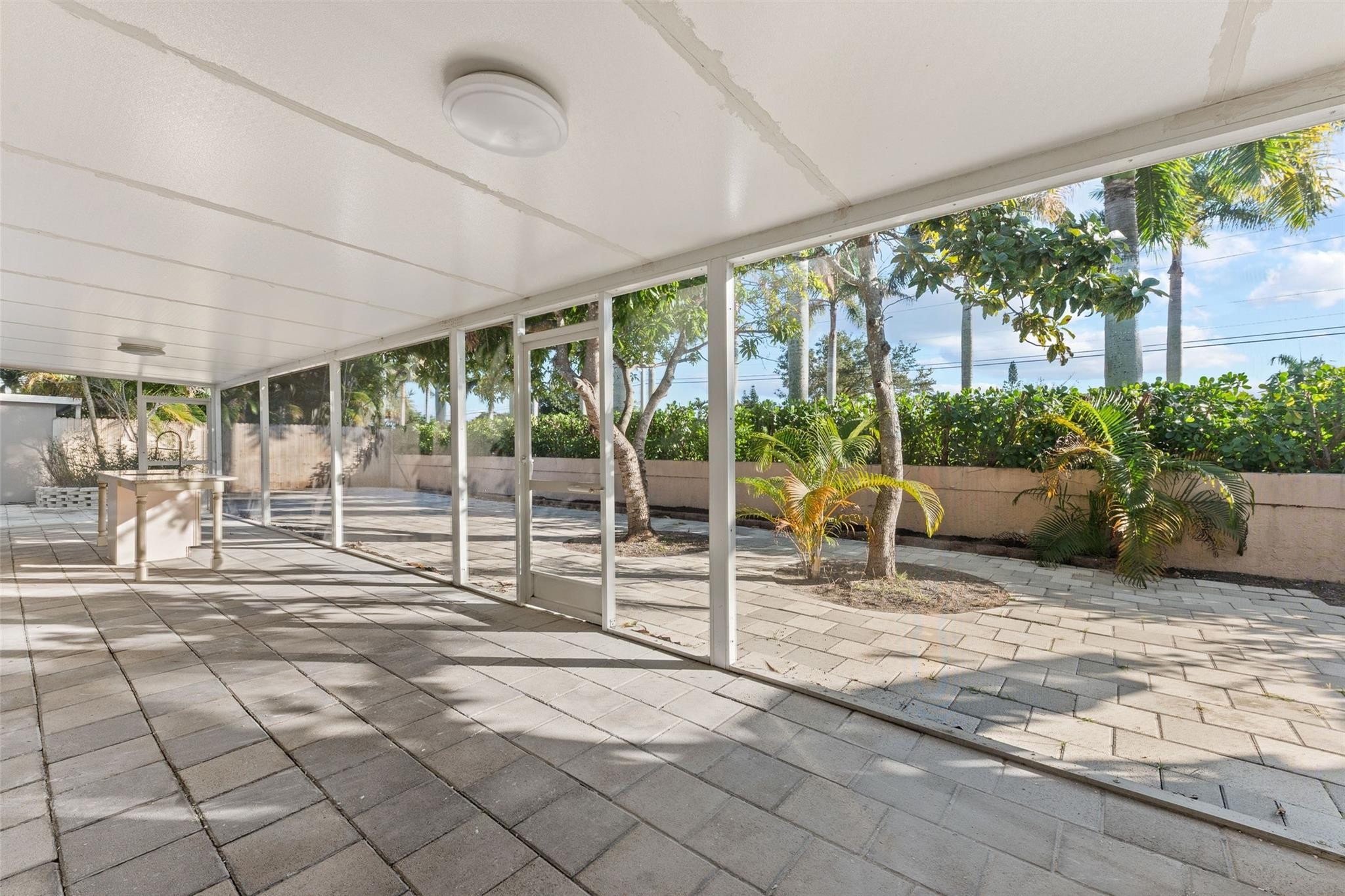 9918 Moss Pond Drive Boca Raton, FL 33496 - Photo 26 of 31 a view of front door with outdoor seating and plants