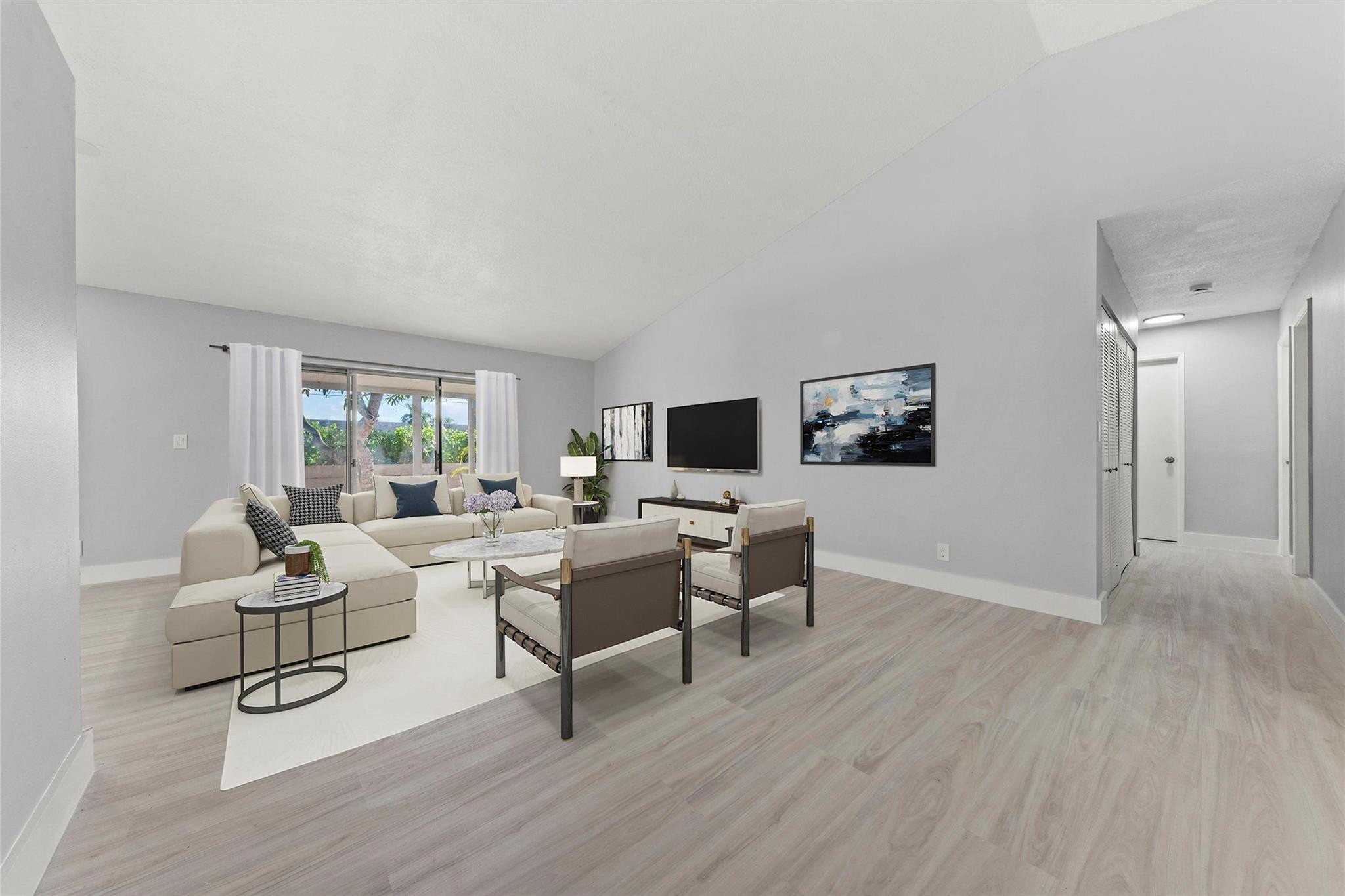 9918 Moss Pond Drive Boca Raton, FL 33496 - Photo 6 of 31 a living room with furniture and a flat screen tv