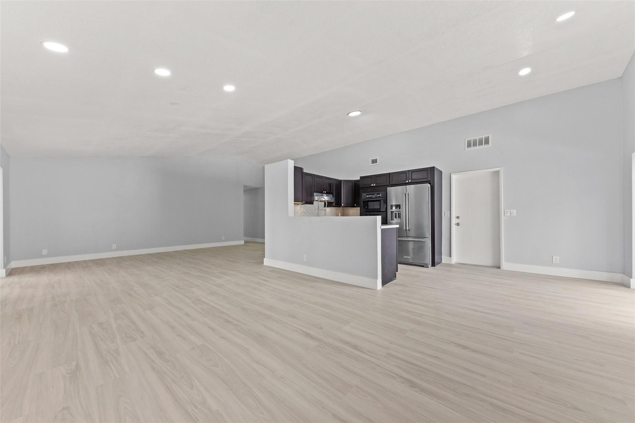 9918 Moss Pond Drive Boca Raton, FL 33496 - Photo 8 of 31 a view of a kitchen with a sink and a refrigerator