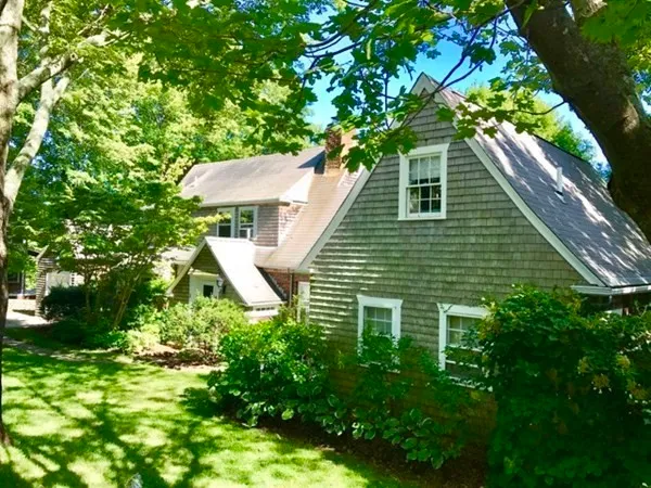 a aerial view of a house with a yard and plants