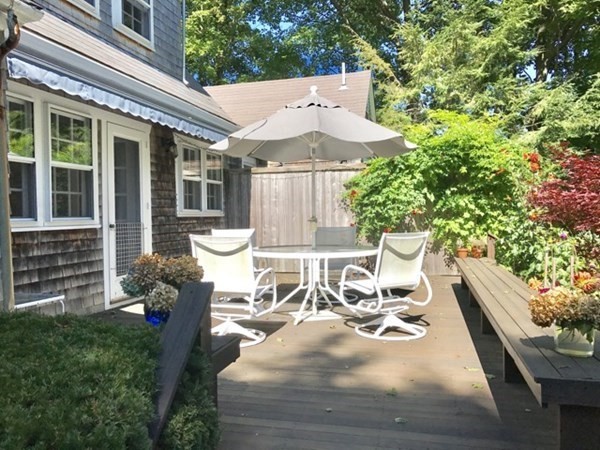 21 William Street Tisbury, MA 02568 - Photo 26 of 27 a view of a patio with table and chairs potted plants and large tree