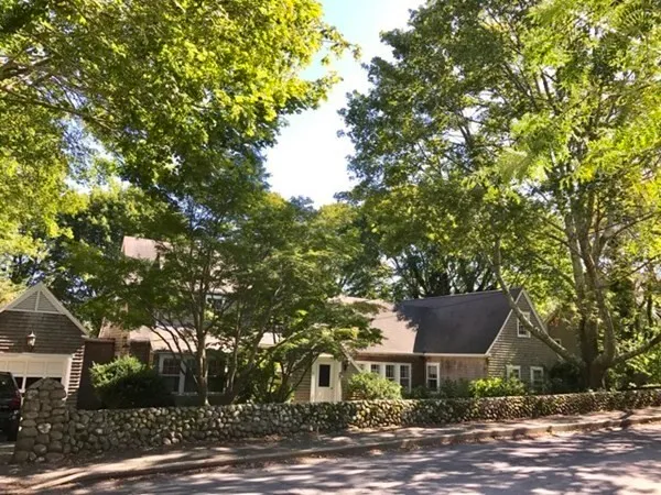a view of a house with a tree