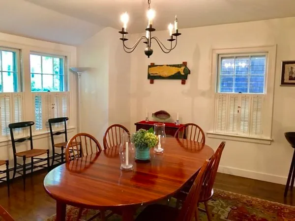 a view of a dining room with furniture and window