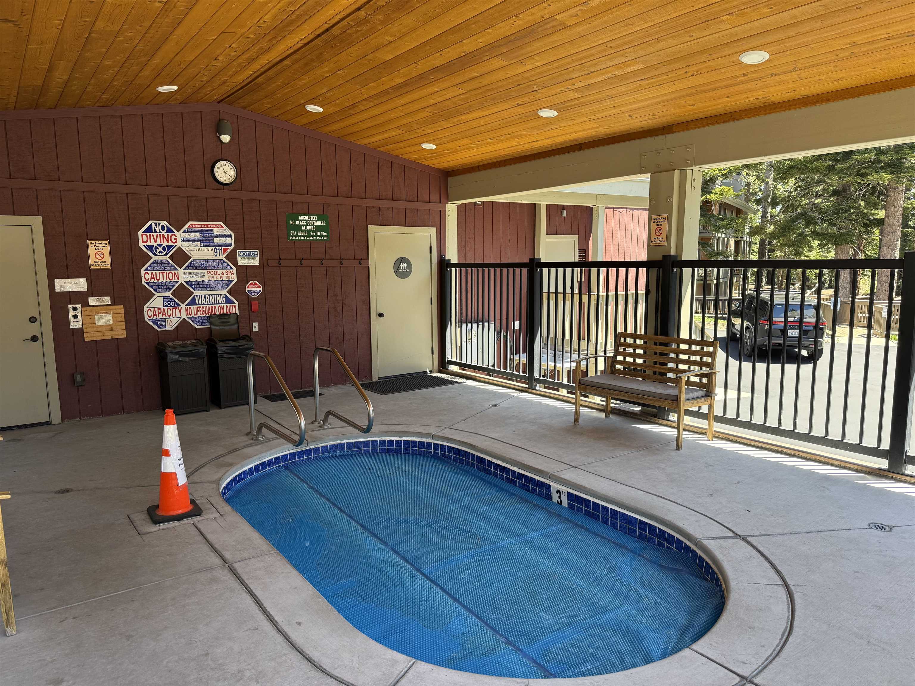 153 Lake Mary Road, Unit 114 Mammoth Lakes, CA 93546 - Photo 20 of 22 Covered outdoor spa with integrated steps and blue tile surround