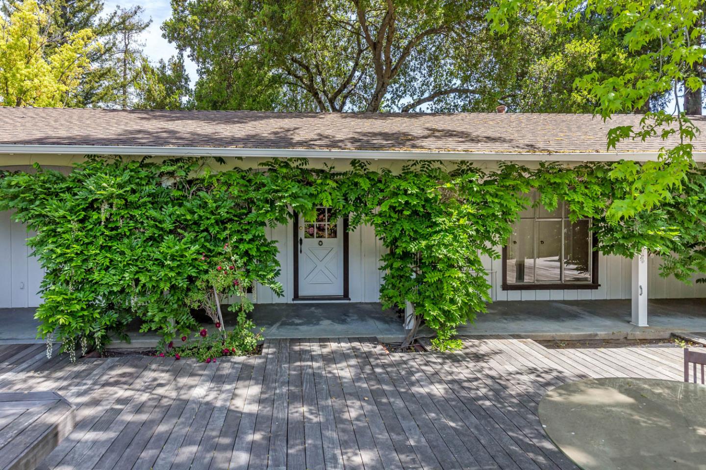 136 Bardet Road Woodside, CA 94062 - Photo 1 of 13 a plant that is in front of a house