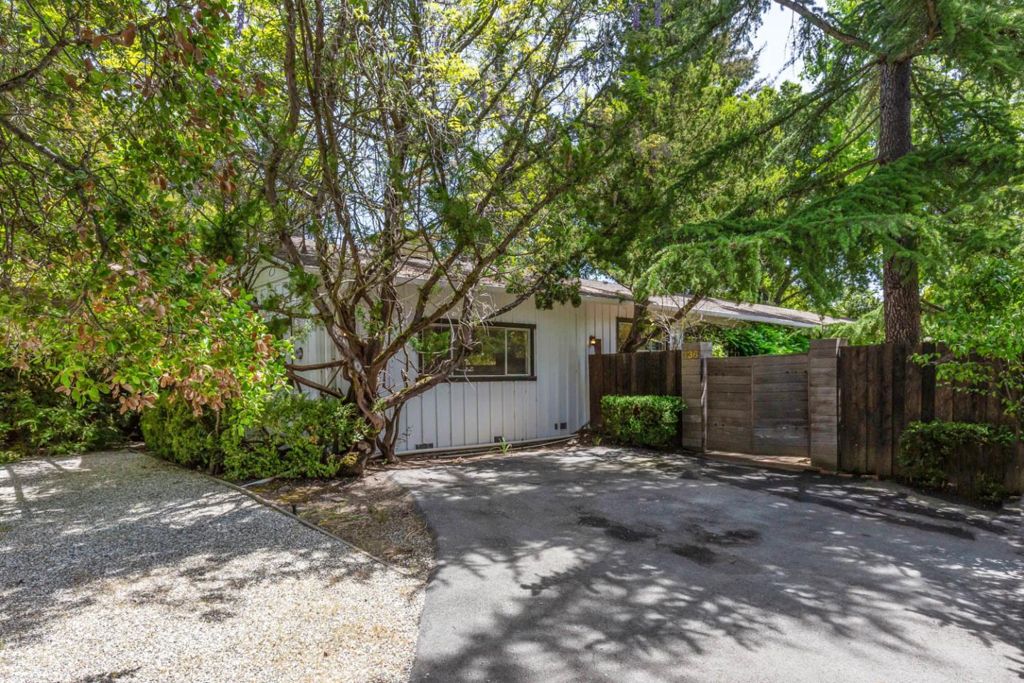 136 Bardet Road Woodside, CA 94062 - Photo 2 of 13 a view of a house with a tree in front of it