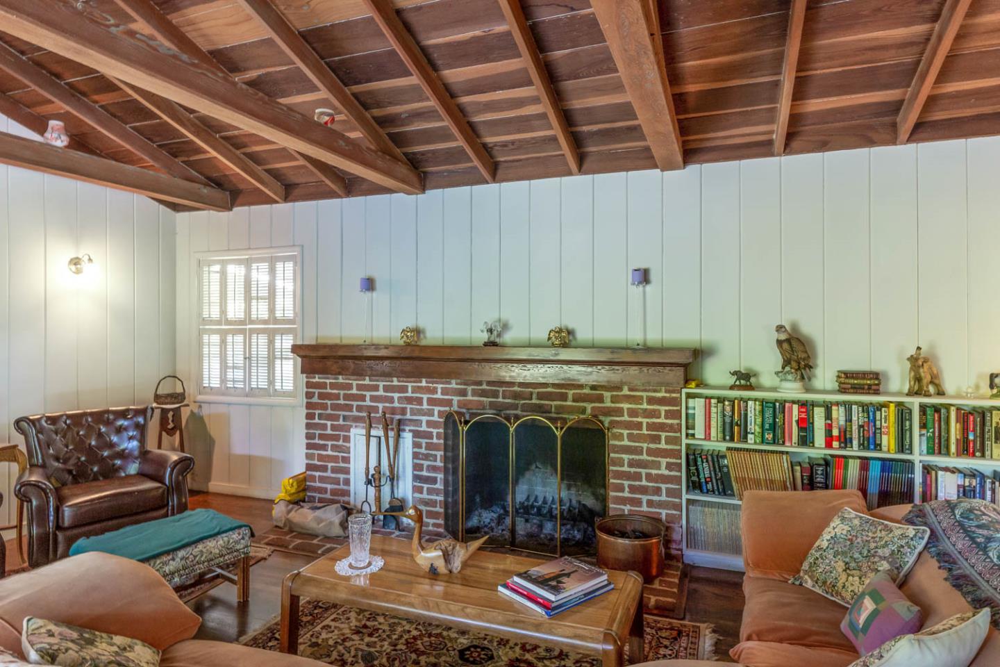 136 Bardet Road Woodside, CA 94062 - Photo 8 of 13 a living room with furniture and a fireplace