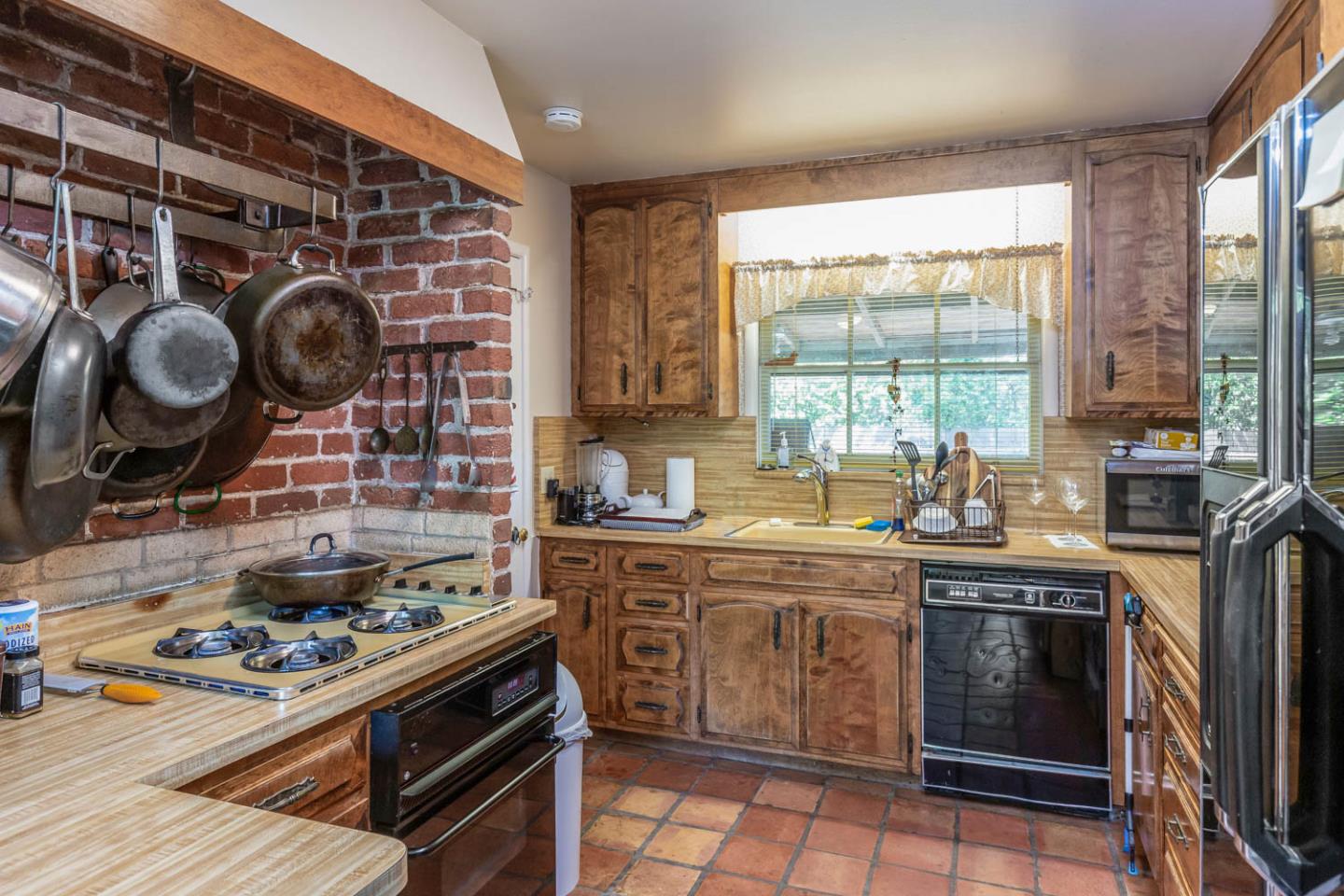 136 Bardet Road Woodside, CA 94062 - Photo 9 of 13 a kitchen with a stove and a sink