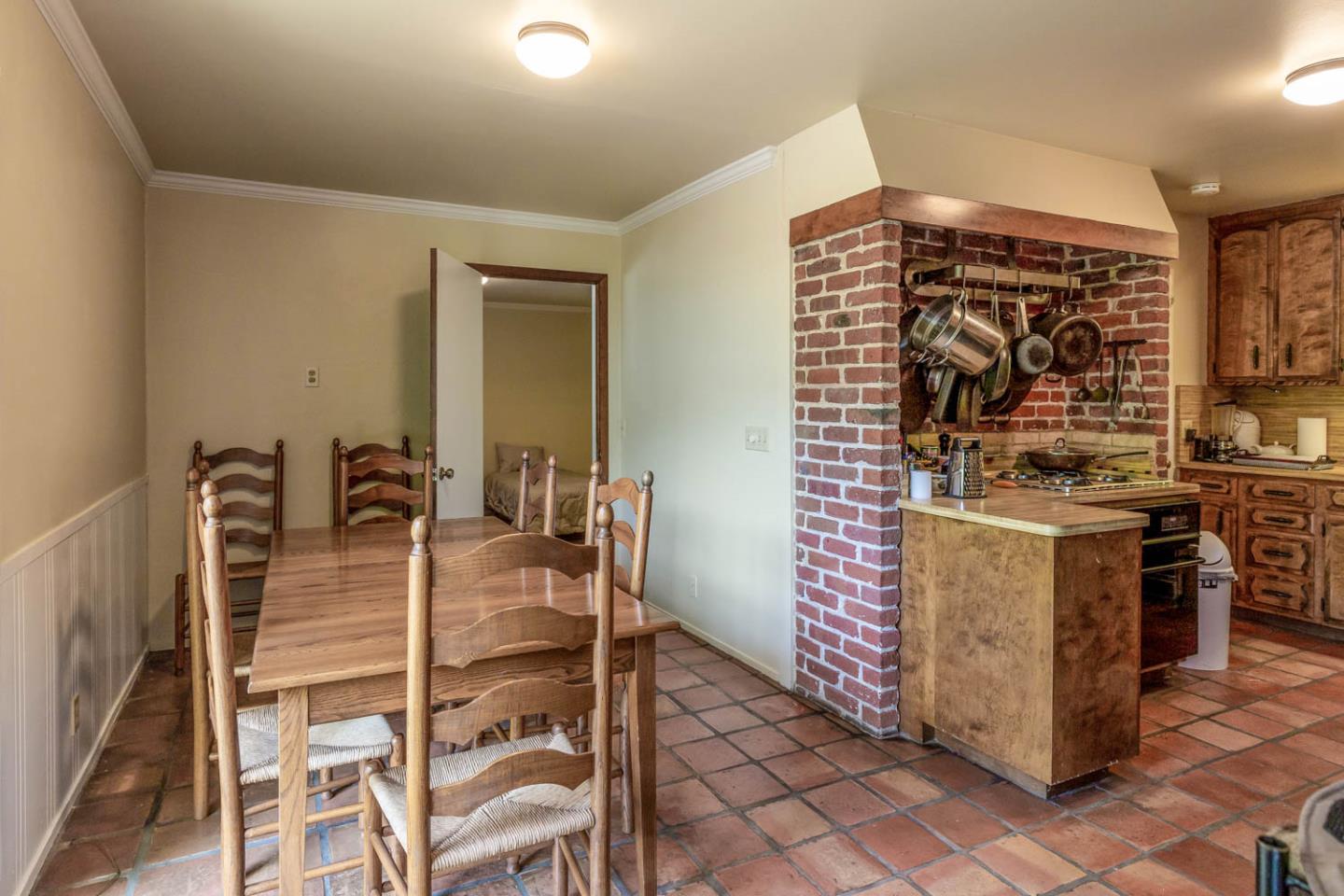 136 Bardet Road Woodside, CA 94062 - Photo 10 of 13 a kitchen with stainless steel appliances kitchen island granite countertop a stove and a sink