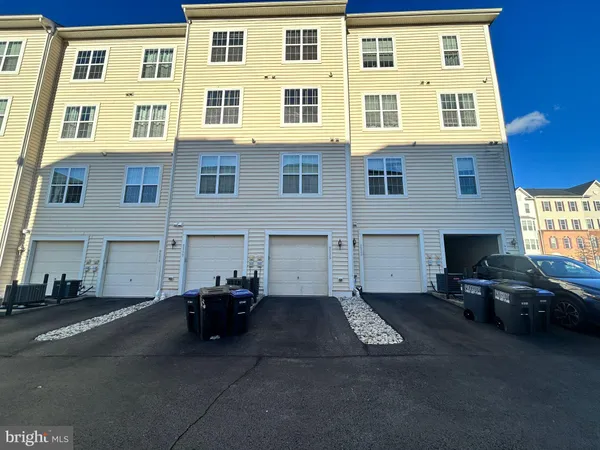 a couple of cars parked in front of a building