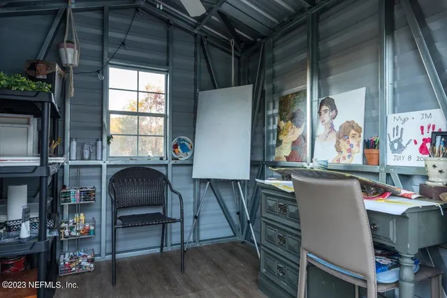 a dining area with furniture and window