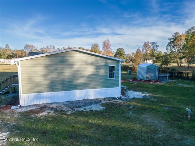 a view of a back yard of the house