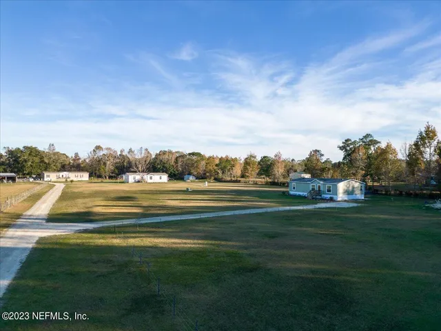 a view of residential houses with outdoor space