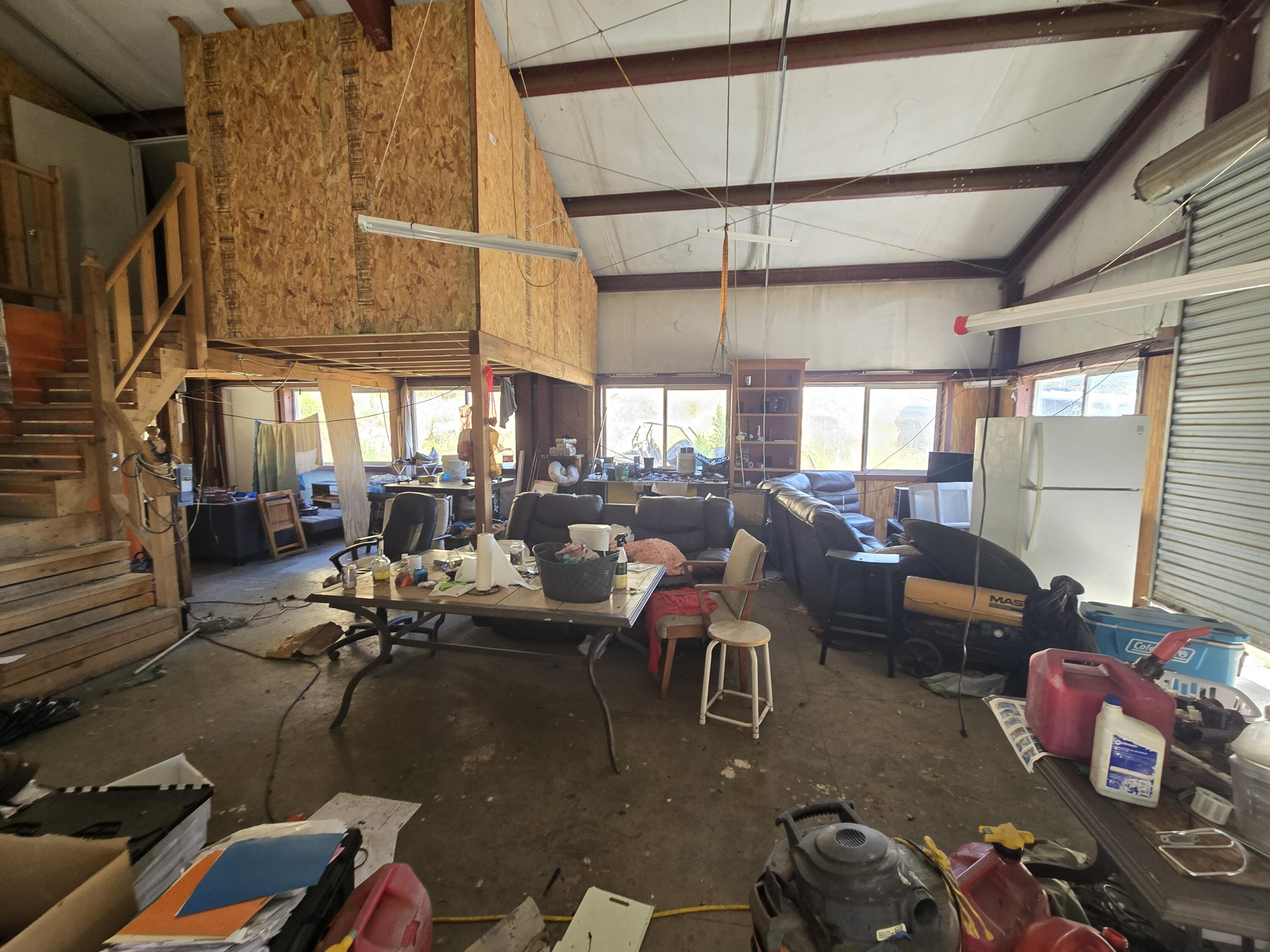 4800 Hansen Ranch Road Garberville, CA 95542 - Photo 2 of 23 a gym room with lots of chairs and mirrors