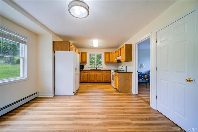 a view of kitchen with wooden floor