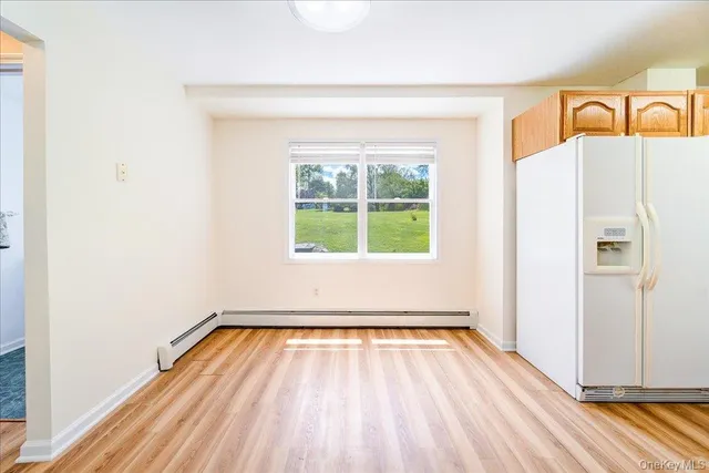 a view of a hardwood floor in a room
