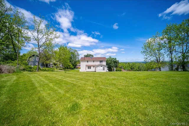 a view of a house with a big yard
