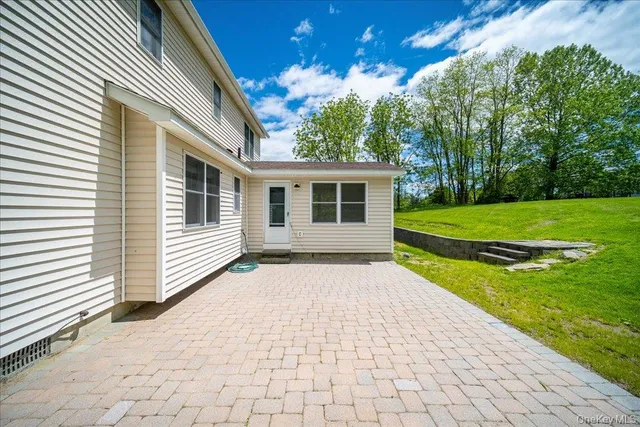 a view of backyard with a garden and plants