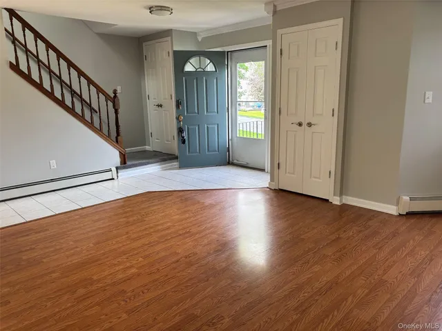 a view of entryway with wooden floor