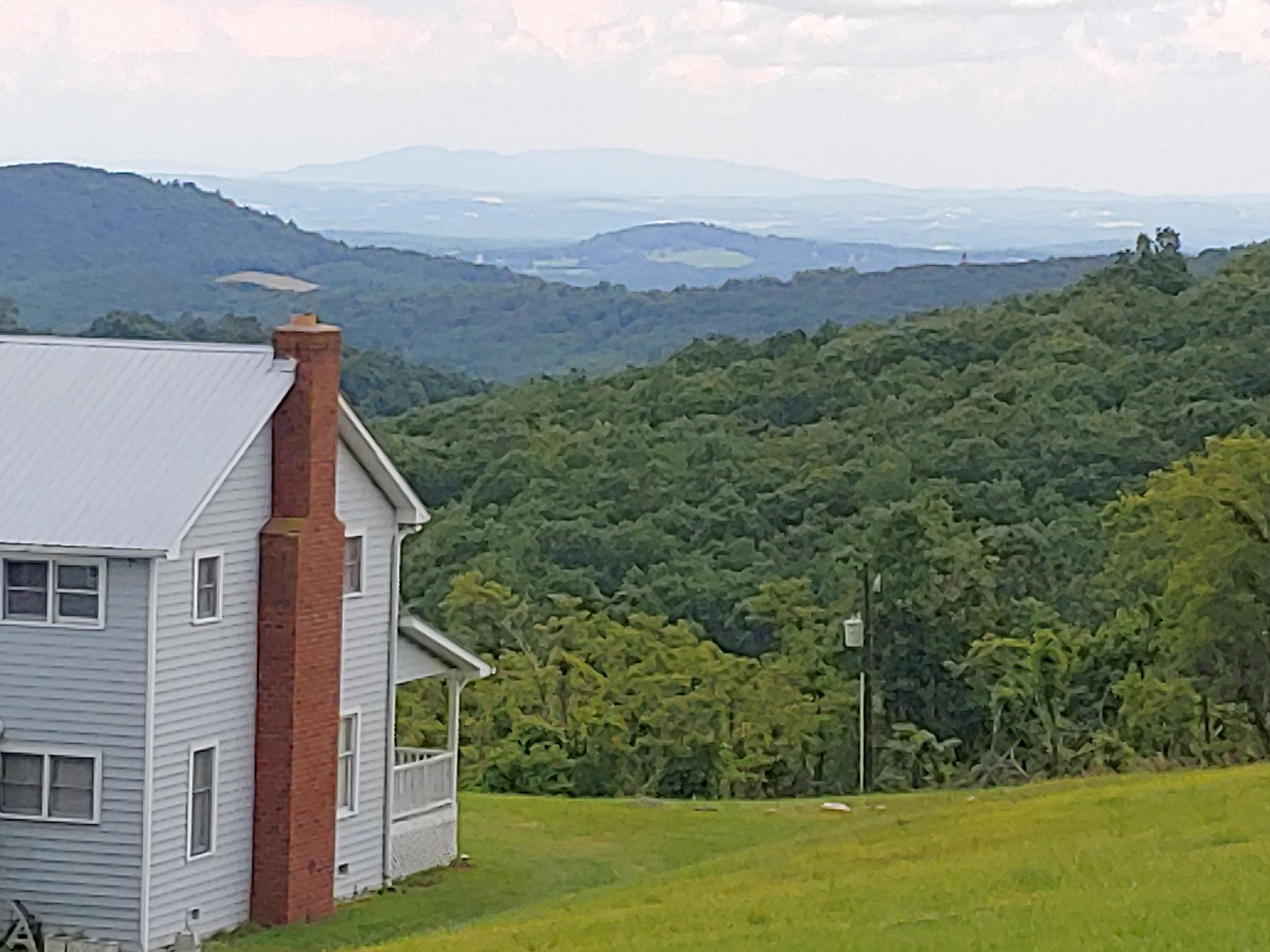 136 Old Fields Road Southwest Floyd, VA 24091 - Photo 1 of 71 a view of a houses with a yard and mountain