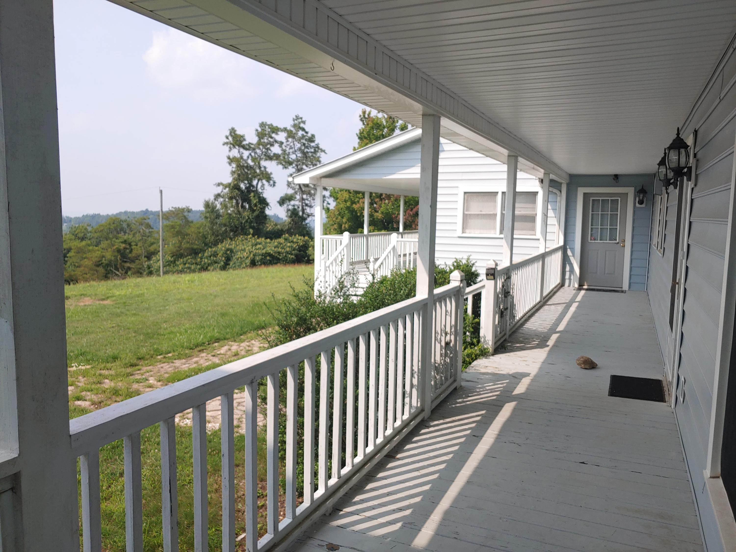 136 Old Fields Road Southwest Floyd, VA 24091 - Photo 11 of 71 a view of a porch with a yard