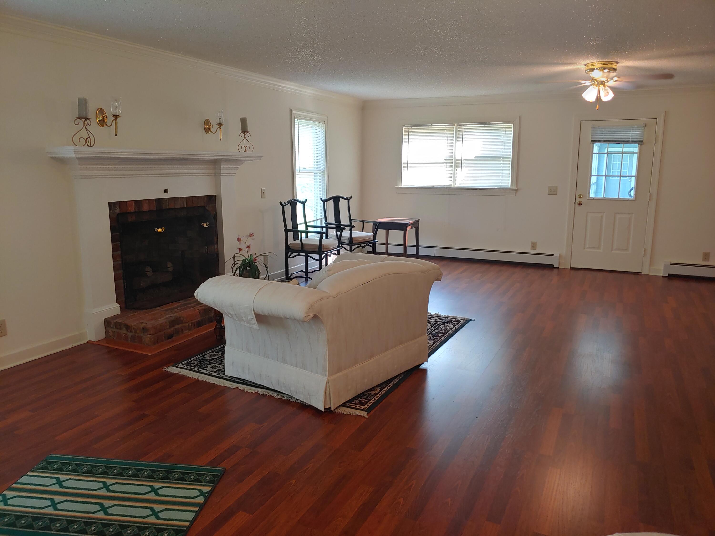 136 Old Fields Road Southwest Floyd, VA 24091 - Photo 18 of 71 a living room with furniture and a fireplace