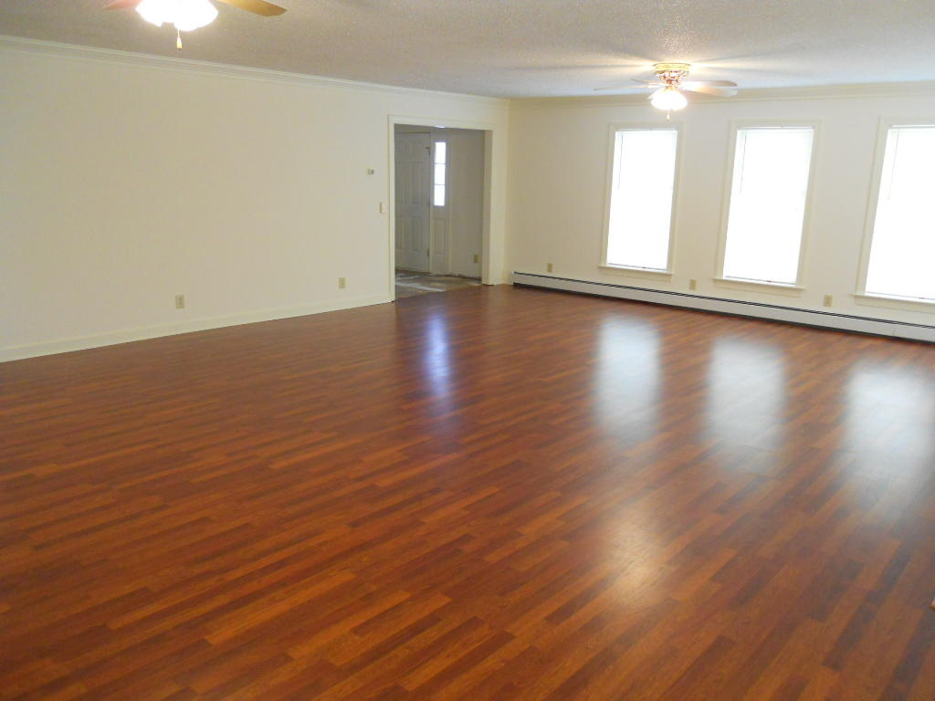 136 Old Fields Road Southwest Floyd, VA 24091 - Photo 20 of 71 an empty room with wooden floor and windows