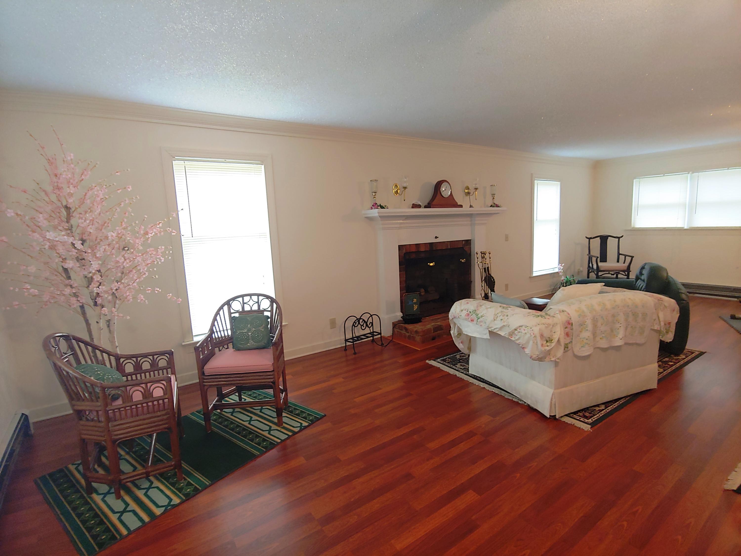 136 Old Fields Road Southwest Floyd, VA 24091 - Photo 21 of 71 a bedroom with furniture and a fireplace